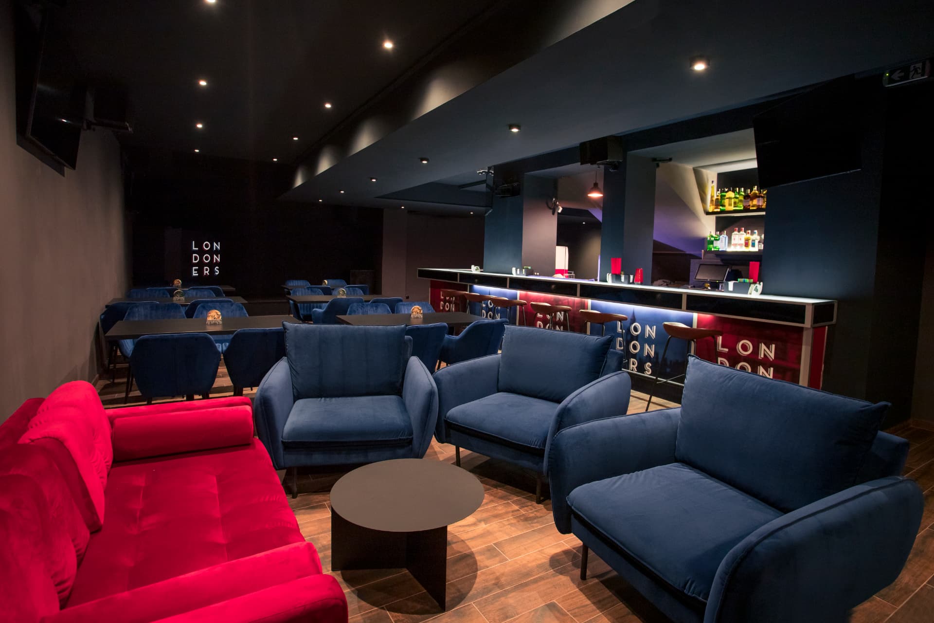 Interior seating and bar at Londoners British pub in Prague