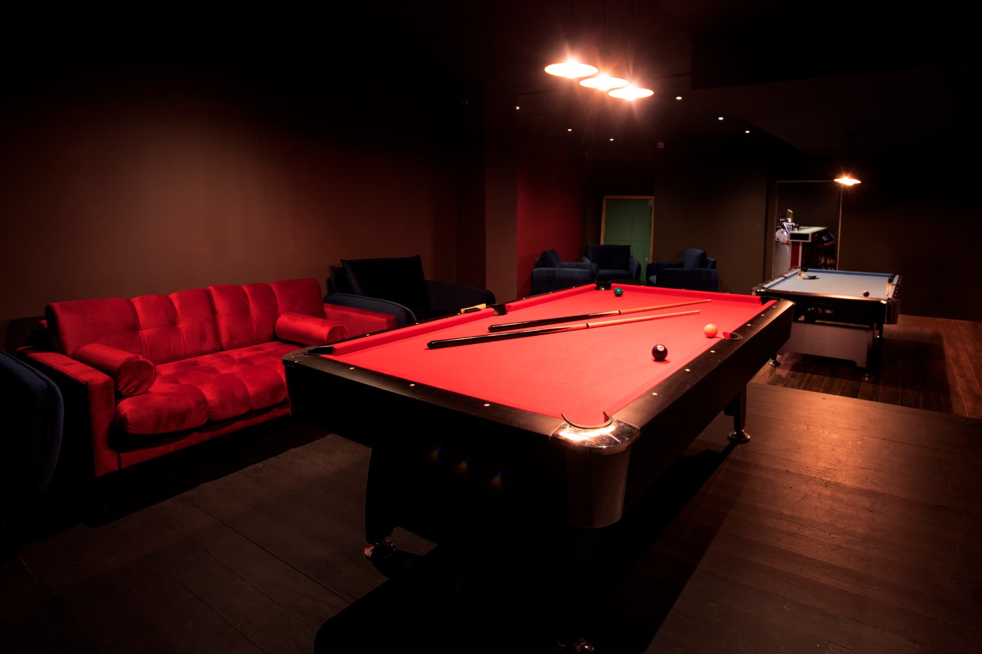 Pool tables and seating in the Londoners games room